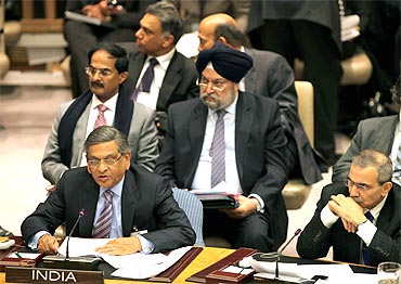 Foreign Minister S M Krishna read the wrong speech at the UN on Friday before being corrected by Ambassador Hardeep Puri, seen standing behind.