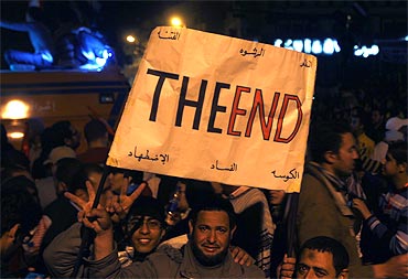 Protesters celebrate the end of Mubarak's regime in Tahrir Square