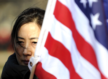 A pro-democracy activist protests against Chinese President Hu Jintao's visit to the US