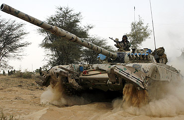 An Indian army tank moves during an army exercise in Rajasthan