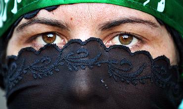 A school girl attends a protest demonstration at a madrasa