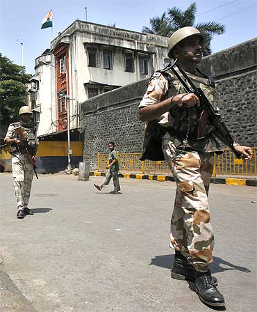 Paramilitary troops patrol outside Arthur Road Jail