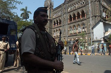 Police personnel stand guard in front of the Bombay high court on Monday