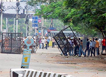 TSJAC members remove police barricades as they clash with RAF personnel on Monday