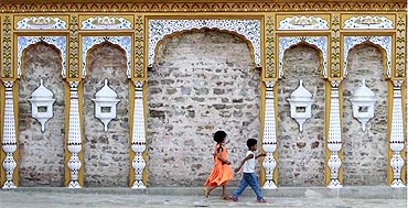 Children play outside an old Hindu temple at Saidpur village on the outskirts of Islamabad