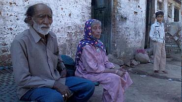 Nafeesa with her husband Anwar Ansari,outside their home in Godhra