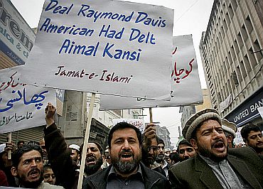Supporters of the Jamaat-e-Islami take part in a protest rally against Raymond Davis in Peshawar