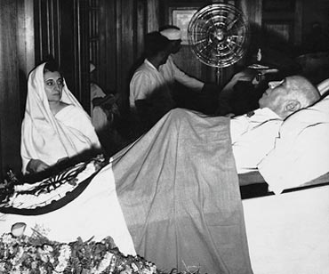 Indira Gandhi watching over her father's body at Teen Murti Bhavan, Delhi
