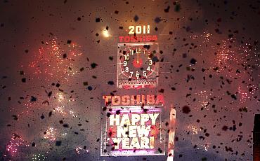 Confetti falls on revellers at midnight during New Year celebrations in Times Square in New York