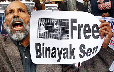 A demonstrator holds a placard as he shouts slogans during a protest demanding the release of Dr Binayak Sen
