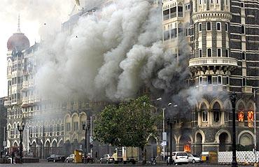 The Taj Mahal hotel is seen engulfed in smoke during a gun battle in Mumbai duirng 26/11 attacks