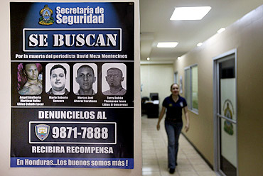 A wanted poster at a police station in Honduras for murderers of journalist David Meza Montecinos