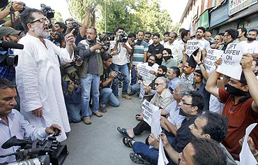 A senior journalist addresses members of the media during a protest in Srinagar on July 10, 2010