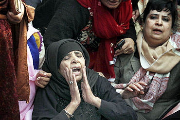 Supporters grieve during funeral prayers for Taseer