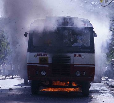 A bus is set alight by students of Osmania University