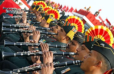 Soldiers play pipes during the Army Day parade in New Delhi
