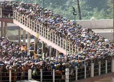 Pilgrims queue outside the Sabarimala Temple to offer prayers to Lord Ayappa