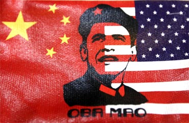 The cover of a wallet bearing an image of US President Barack Obama's face, in place of the usual image of China's late Chairman Mao Zedong, is pictured at a souvenir shop inBeijing on Tuesday