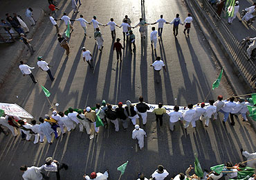 Supporters of various religious parties take part in a rally in support of the Pakistani blasphemy law in Karachi