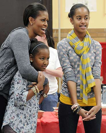 First lady Michelle Obama with daughters Sasha and Malia