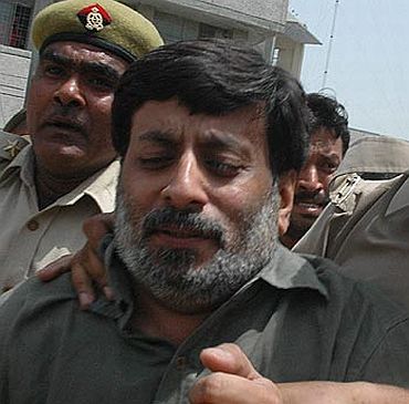File photo of Rajesh Talwar being taken into custody