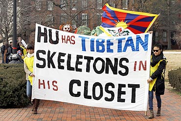 Tibetan Americans march with a protest banner during a protest against visiting Chinese President Hu Jintao in Washington