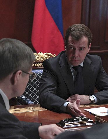 Russia's President Dmitry Medvedev talks to Prosecutor General Yury Chaika during a special meeting at the presidential residence outside Moscow following the blast on Monday