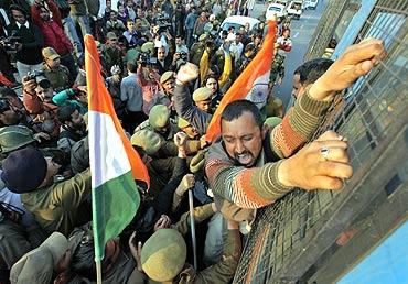 A BJP supporter shouts slogans during a protest near the airport in Jammu