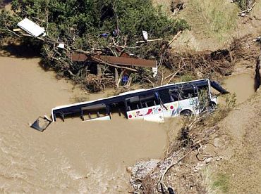 An aerial view shows a bus in the Nartuby river in Draguignan, southeastern France, June 18, 2010