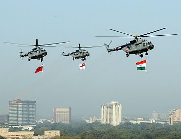 IAF Helicopters carrying the tricolour and services flag