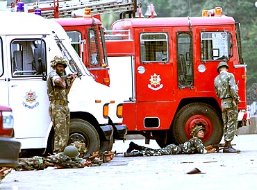 Paramilitary personnel take guard near Taj Mahal Hotel during the 26/11 terror attacks