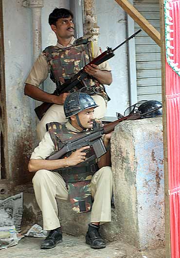 Policemen keep a watch near Nariman House in Mumbai during 26/11