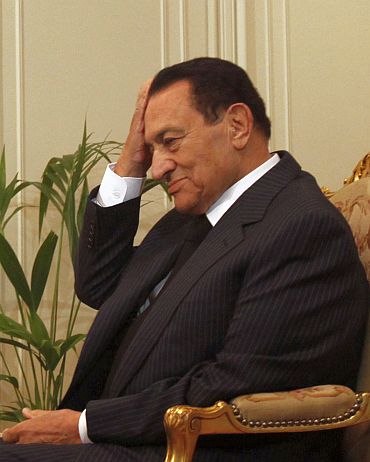 Egyptian President Hosni Mubarak gestures