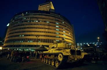 A military tank sits next to the Egyptian state television building in Cairo