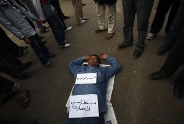 A protester sleeps at Tahrir Square in Cairo
