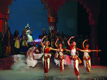 Students performing an invocation dance in front of the Goddess Saraswati