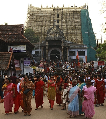 Devotees leave Sree Padmanabhaswamy temple after offering prayers on the eve of Pongala festival in Thiruvananthapuram