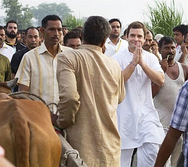 Rahul Gandhi interacts with a farmer during the padyatra