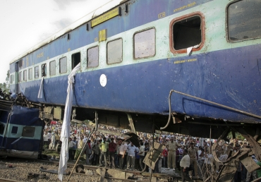 People gather around the mangled carriages of Kalka Mail