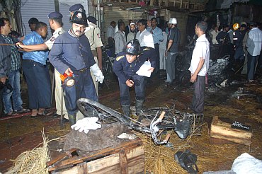 Fire brigade personnel at the blast site at Zaveri Bazaar