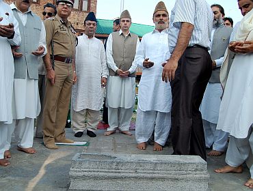 Jammu and Kashmir CM Omar Abdullah pays tribute in the martyr's graveyard in Srinagar on Wednesday