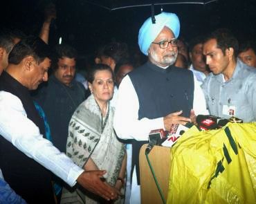 Prime Minister Manmohan Singh speaks to reporters at JJ Hospital in Mumbai.