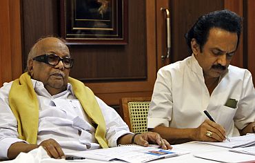 DMK chief M Karunanidhi with former deputy CM M K Stalin at the party headquarters in Chennai