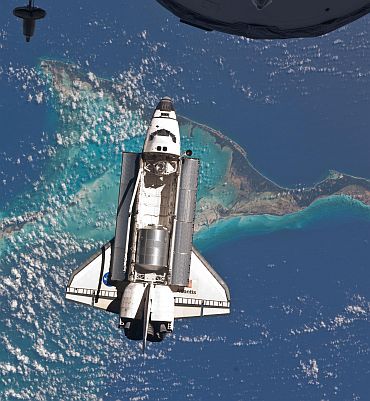 Space shuttle Atlantis is seen over the Bahamas