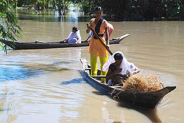 Villagers using boats to move around, in Lakhimpur