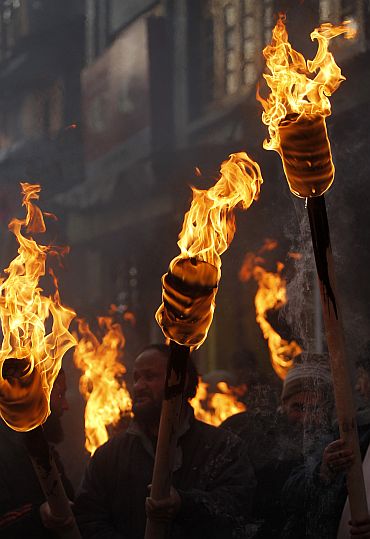 Kashmiri separatists hold torches to mark International Human Rights Day in Srinagar
