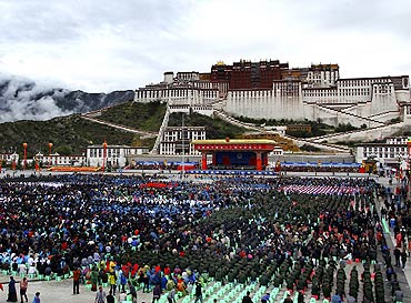 Ethnic Tibetans and residents gather in front of the Potala Palace to join the celebration of the 60th anniversary of Tibet's peaceful liberation in Lhasa