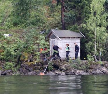 Police members search for evidence on Utoeya island