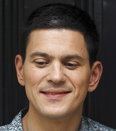 Labour politician David Miliband poses for a photograph outside his home in London