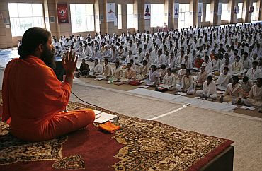 Baba Ramdev speaks duirng a yoga camp in Haridwar